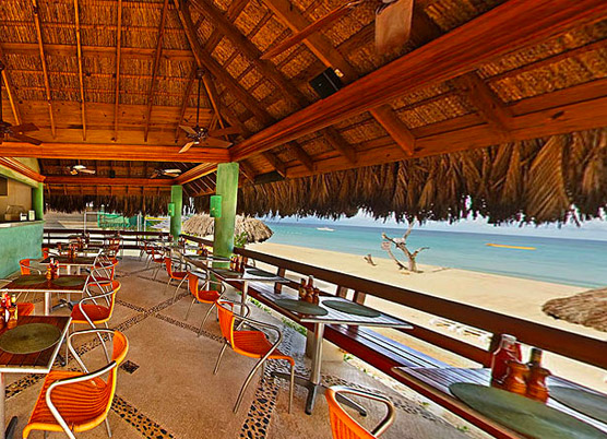 cabana grill bar during the day next to the beach